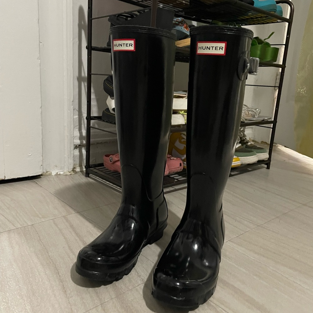 Tall black hunter boots